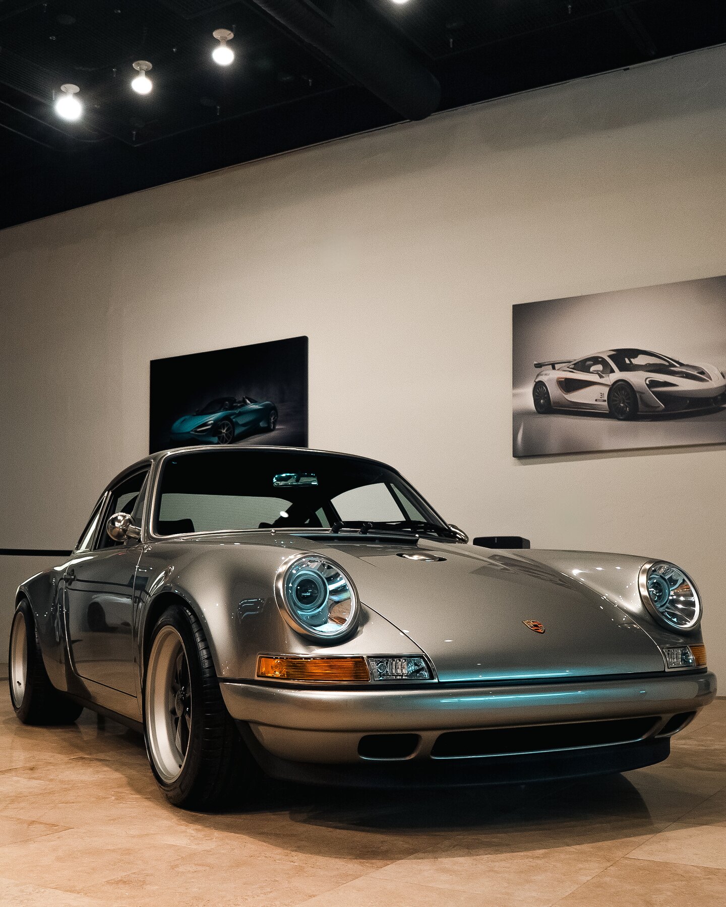 Silver Porsche 911 inside a private automotive collection, photographed by DST.